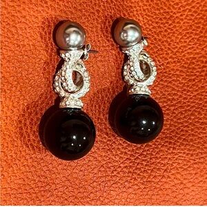 IMAN silver and black earrings.